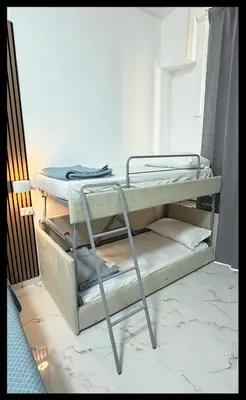 a bedroom with a large bed and a chair at BeLLa Vista in Rome