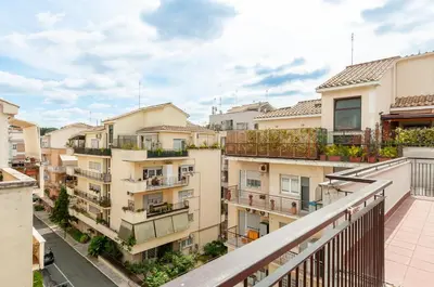 an apartment balcony with a view of buildings at L'Attico di Katia in Rome