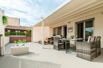 an outdoor patio with chairs and a table at L'Attico di Katia in Rome