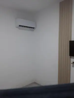 a room with a white wall with a air vent at Emmanuella Casa in Rome