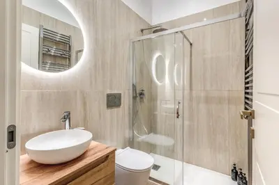 a bathroom with a sink and a shower at 3 minutes walk from Termini Station With Temple View in Rome