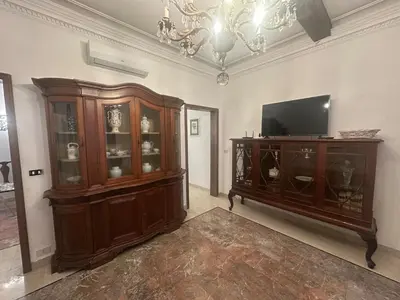 a living room with a television and a entertainment center at Borgo Pio Vatican in Rome