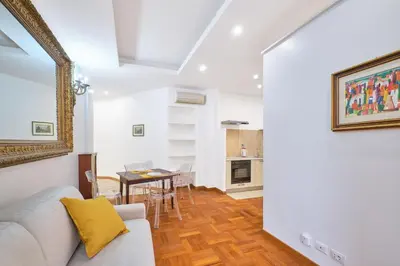 a living room with a couch and a table at 2ND Level in Rome
