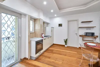 a kitchen with a table and a counter top at 2ND Level in Rome