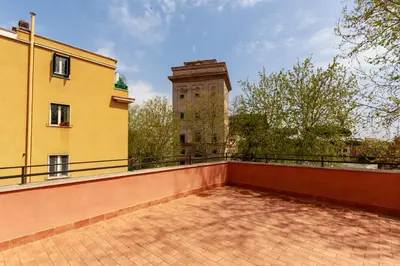 a balcony of a building with a clock tower at Villa Aurora Rooms in Rome