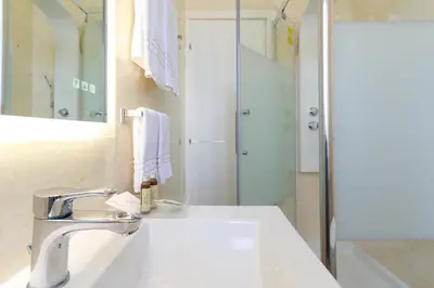 a bathroom with a sink and a shower at Villa Aurora Rooms in Rome