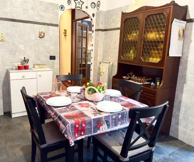 a dining room table with a tablecloth on it at Mancinelli Rome Apartment in Rome