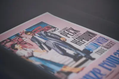 a magazine with a picture of a man in a suit at Habitat 42 Roman Stay in Rome