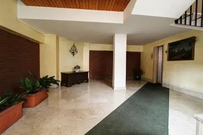 a hallway of a building with plants in it at Le Note Di Angela in Rome