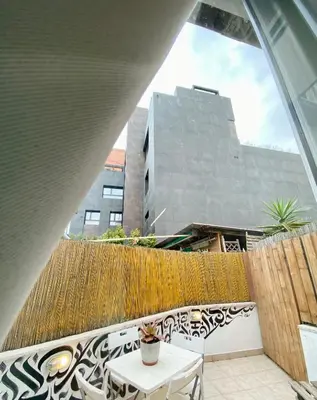 a balcony with a table and a fence at PIRAMIDE Romantic Home in Rome