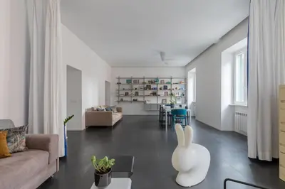 a living room with a couch and a table at HospitalityRome Vittorio Emanuele in Rome