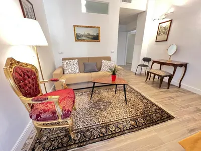 a living room with a couch and a table at Trastevere10 in Rome