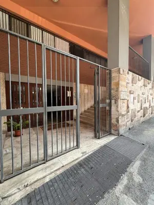 a metal gate in front of a building at Trastevere10 in Rome