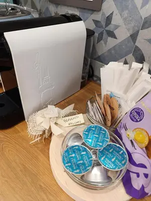 a desk with a plate of cookies and a printer at Casa Vacanze LaMatta Music House in Rome