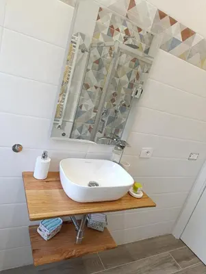 a bathroom with a sink and a mirror at Casa Vacanze LaMatta Music House in Rome