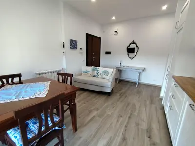 a living room with a table and a couch at Casa Vacanze LaMatta Music House in Rome