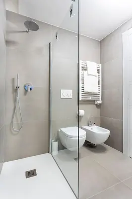a bathroom with a shower and a toilet and a sink at Colosseum Luxury suite 41 in Rome