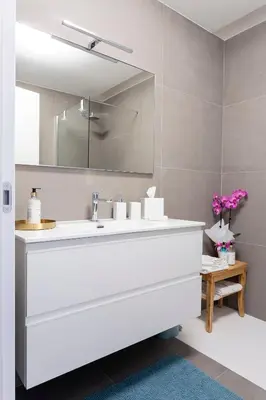 a bathroom with a white sink and a mirror at Colosseum Luxury suite 41 in Rome