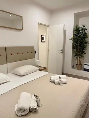 a bedroom with two towels on a bed at Appartamento stazione trastevere in Rome