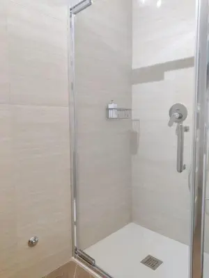a shower with a glass door in a bathroom at Casa Beatrice, Trastevere in Rome