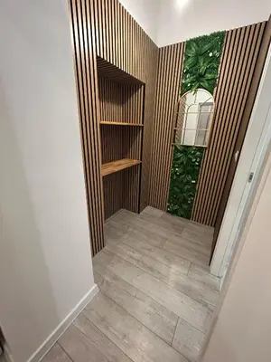 a hallway with a book shelf in a room at Leonidas house 2 in Rome