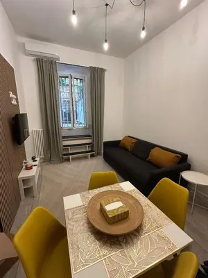 a living room with a couch and a table at Leonidas house 2 in Rome