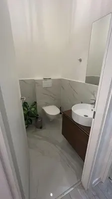 a bathroom with a sink and a toilet and a mirror at Leonidas house 2 in Rome