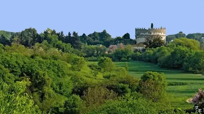 a castle on top of a hill with trees at Casa Alice in Rome