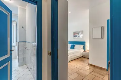 a room with a bed and a bathroom at La Casa di Taumasia in Rome