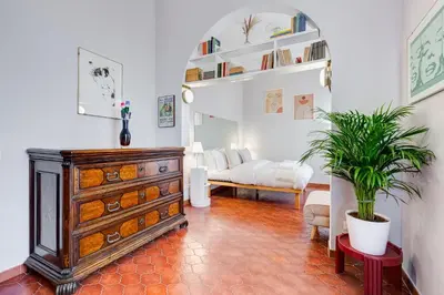 a living room with a dresser and a couch at Terrace with a view of Rome in Rome