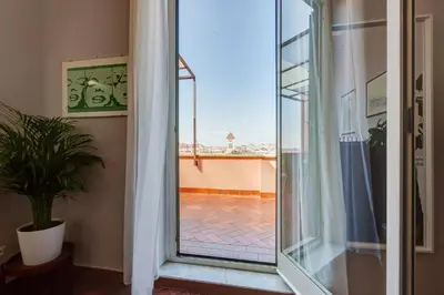 a room with a sliding glass door with a view at Terrace with a view of Rome in Rome