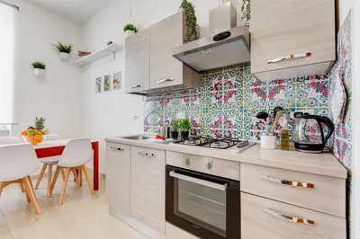 a small kitchen with a stove and a table at Terrace with a view of Rome in Rome