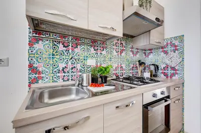 a kitchen with a sink and a stove at Terrace with a view of Rome in Rome