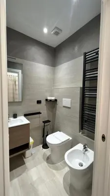 a bathroom with a toilet and a sink at Antony house in Rome