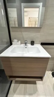 a bathroom with a white sink and a mirror at Antony house in Rome