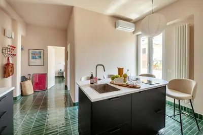 a kitchen with a sink and a counter at Cipria Luxury Apartment in Rome