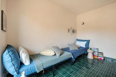 a room with two blue couches in a room at Cipria Luxury Apartment in Rome