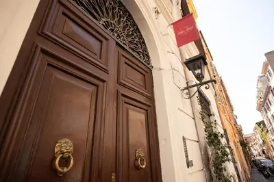 a large wooden door on the side of a building at Relais Monti in Rome