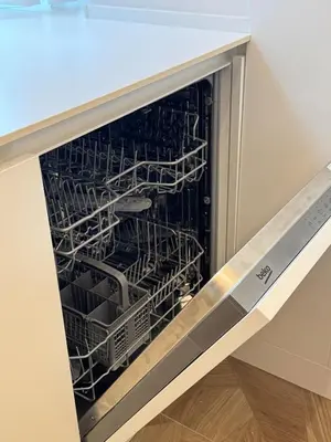an empty dishwasher with dishes inside of it at Re&x Home Rome Near Coloseum in Rome
