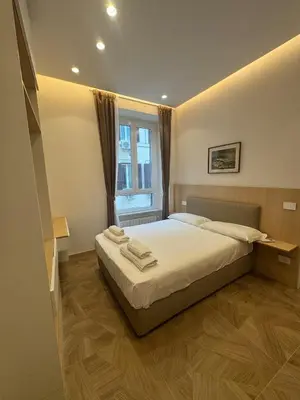 a bedroom with a bed and a window at Re&x Home Rome Near Coloseum in Rome