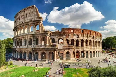 a group of people walking around the coliseum at Private room by an Italian family - A unique experience close to Colosseum, the Roman Forum and Basilica Saint Mary Major in Rome