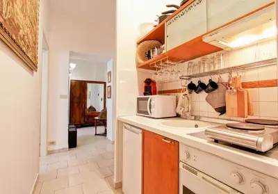 a kitchen with a sink and a microwave at BigFamilyFlats - Colosseo&Monti - ROOMS in Rome