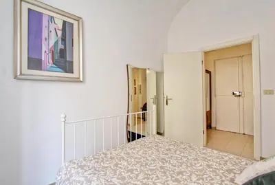 a bedroom with a bed and a picture on the wall at BigFamilyFlats - Colosseo&Monti - ROOMS in Rome