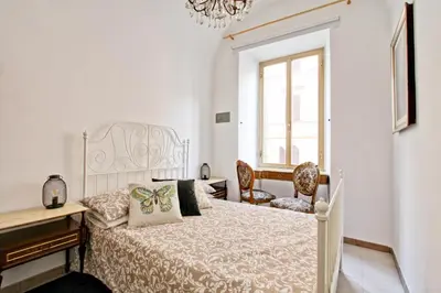 a bedroom with a bed and a desk and a window at BigFamilyFlats - Colosseo&Monti - ROOMS in Rome