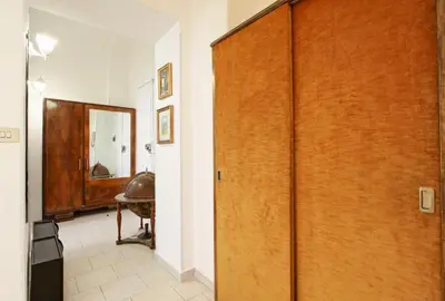 a hallway with a wooden door in a room at BigFamilyFlats - Colosseo&Monti - ROOMS in Rome