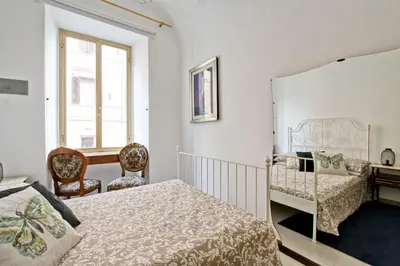 a bedroom with two beds and a desk at BigFamilyFlats - Colosseo&Monti - ROOMS in Rome