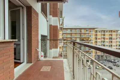 a balcony with a view of a city at 8bit Dreams - Al Pigneto - 100 m da Metro Malatesta in Rome