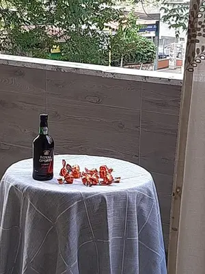a bottle of wine sitting on top of a table at Casa Jasmine in Rome