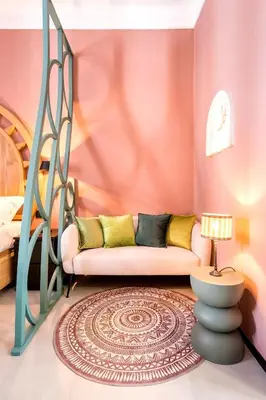 a living room with a couch and a bed at B HOUSE - luxury apartment Trastevere in Rome