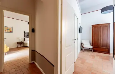 a hallway with a door leading to a bedroom at Colosseum Suites - Zen 22 in Rome